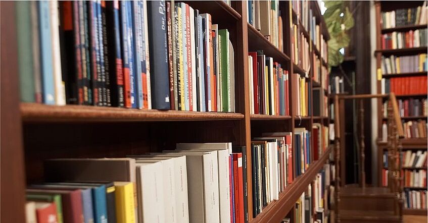 Row of bookshelves in a library.