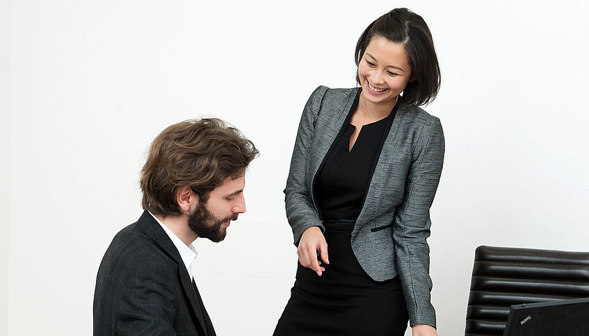 two working colleagues talking