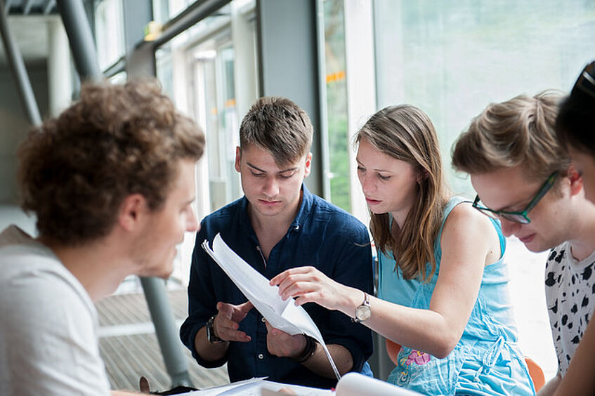 Students are having a group meeting.